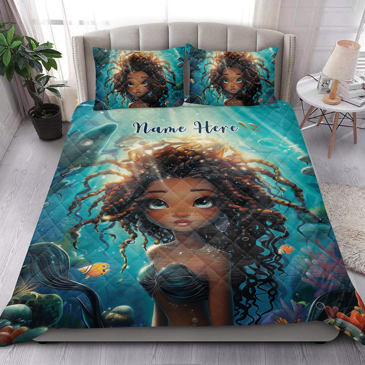 Black girl quilt bedding displayed in a bright bedroom with turquoise underwater portrait artwork and matching pillowcases