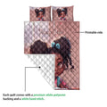 Black girl quilt blanket shown with a printed front and white quilted backing detail
