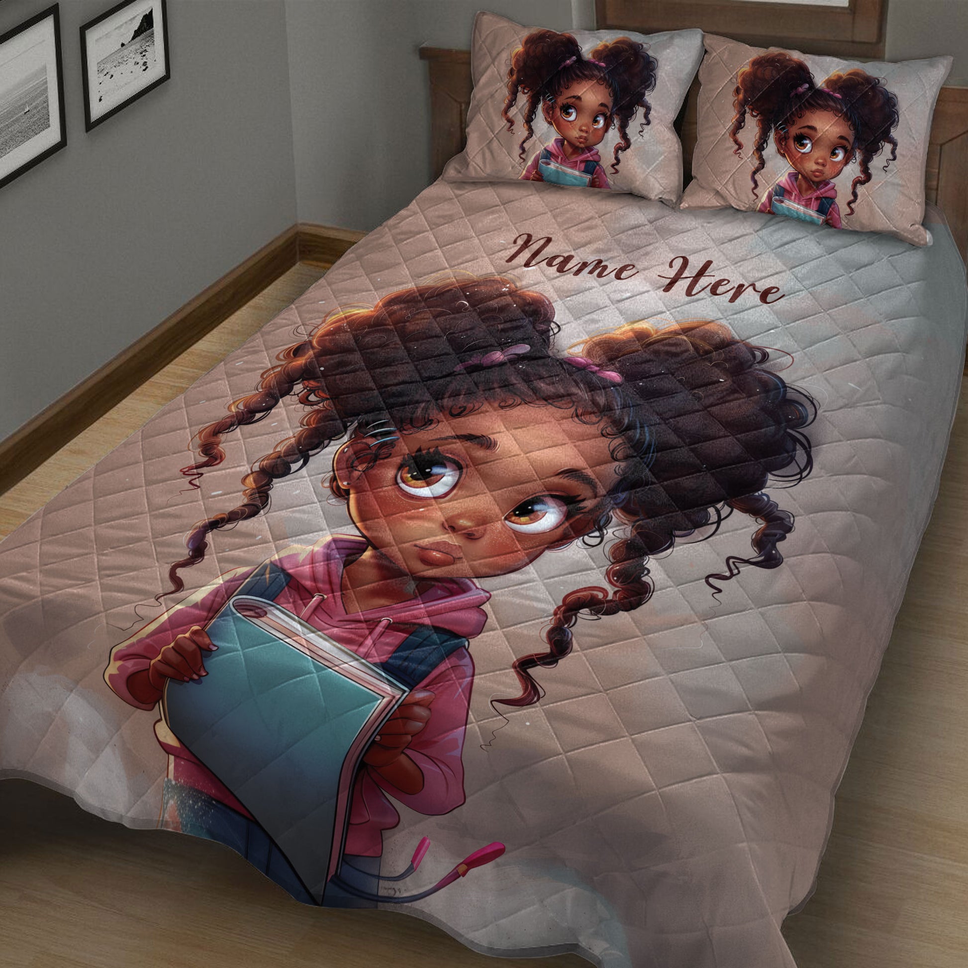 Close bedroom view of a Black girl quilt blanket with colorful student-themed artwork