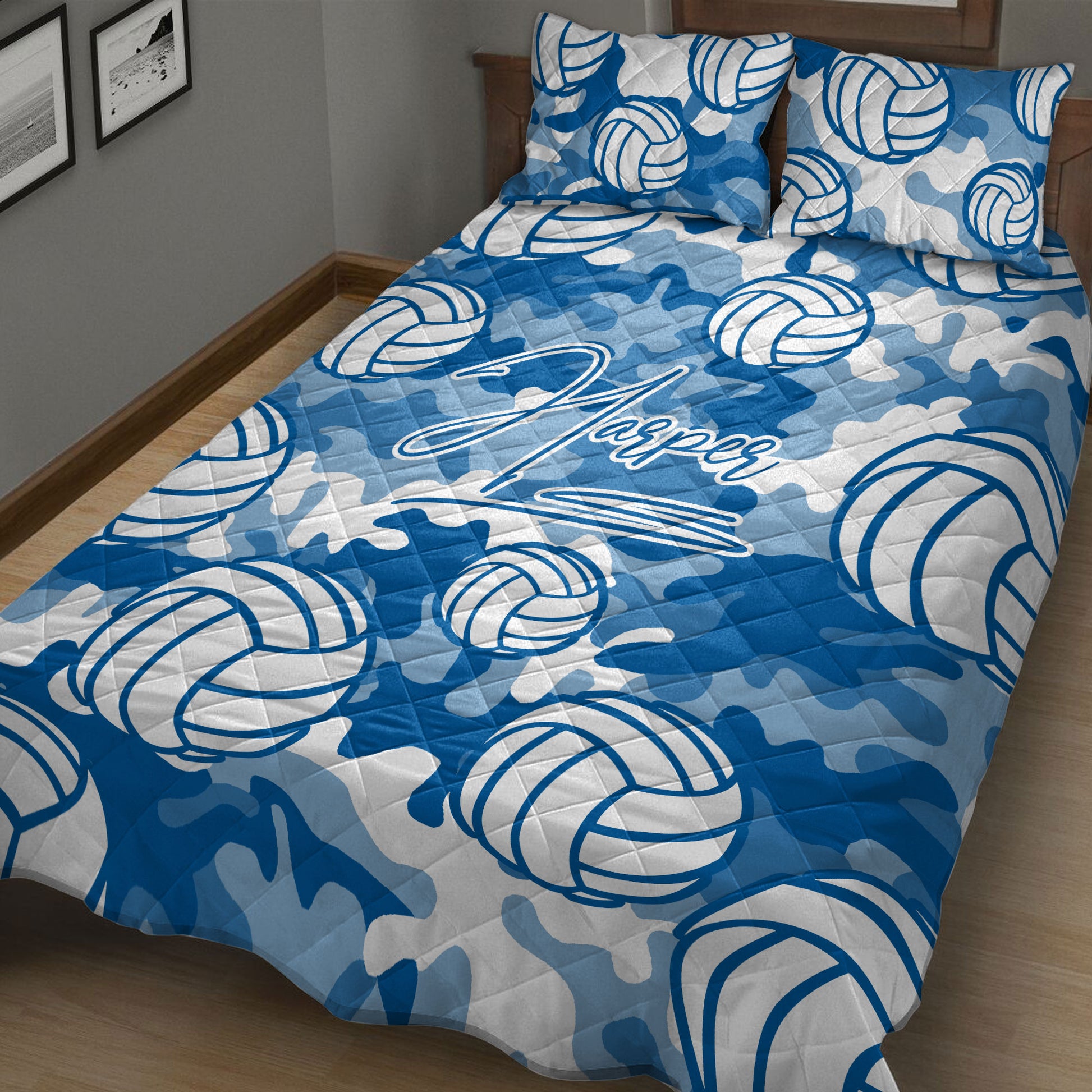 Blue volleyball quilt blanket displayed on a bed with bold sports artwork