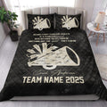 Black cheerleading quilt blanket styled on a bedroom bed with megaphone and team tribute artwork