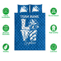 Blue cheerleading quilt blanket shown with soft breathable, washable, and colorfast feature icons