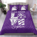 Purple cheerleading quilt blanket styled in a bedroom with megaphone, pom pom, and bow graphics