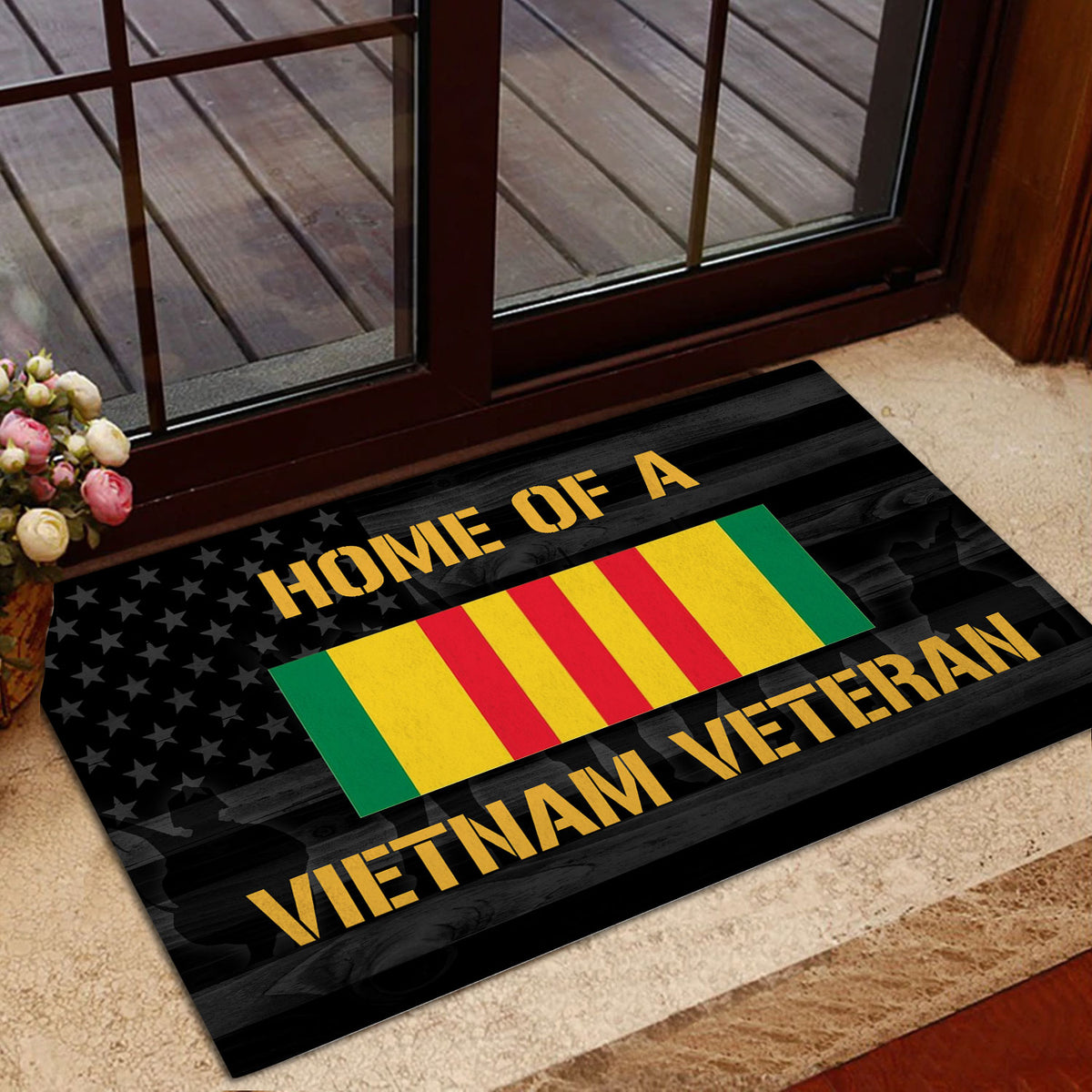 Vietnam Veteran doormat placed near a glass entry door with patriotic artwork and dark wood styling