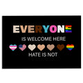 Black LGBT doormat with colorful hearts and an inclusive welcome message