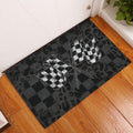 Racing doormat displayed at an entryway with crossed checkered flags and dark plaid styling