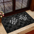 Crossed checkered racing flag doormat displayed near a glass entry door
