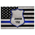 Police badge doormat with stars and stripes, black and gray flag design, and a blue accent stripe