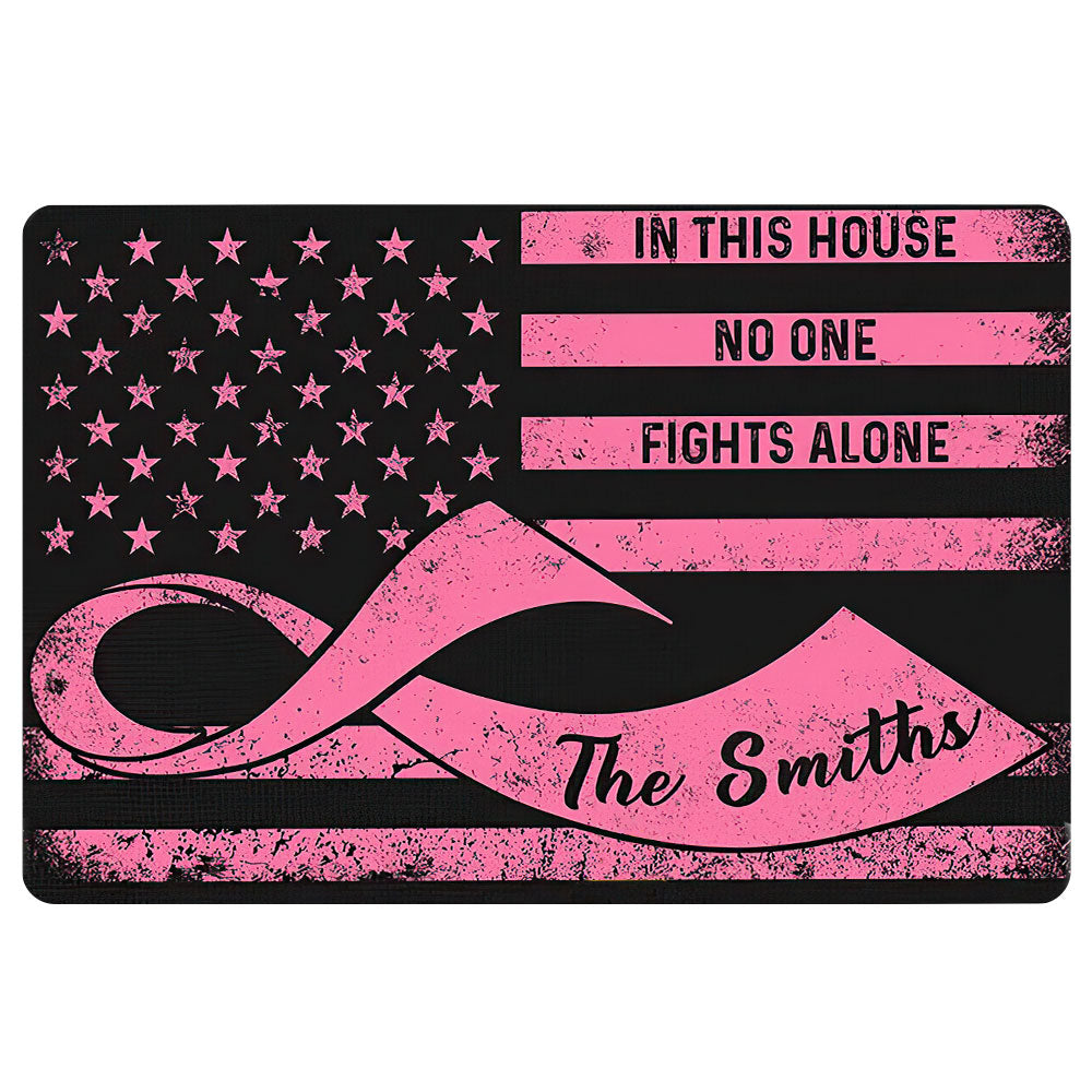 Black and pink breast cancer doormat featuring a ribbon, star pattern, and supportive entryway message