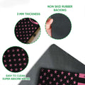 Feature view of pink ribbon breast cancer doormat artwork with a black rubber backing