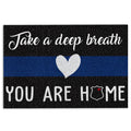 Police-themed doormat with a blue line, white heart, badge emblem, and welcoming message