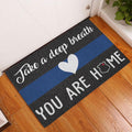 Police blue line doormat displayed in a home entryway on a wood floor