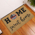 Firefighter welcome doormat displayed by a white door on a wood floor entryway