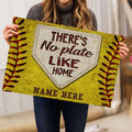 Person holding a yellow softball doormat with home plate artwork and bold entryway lettering
