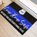 Blue stripe police door mat positioned at an indoor doorway with a badge design