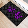Black racing door mat with bold purple checkered flags shown in an indoor entryway