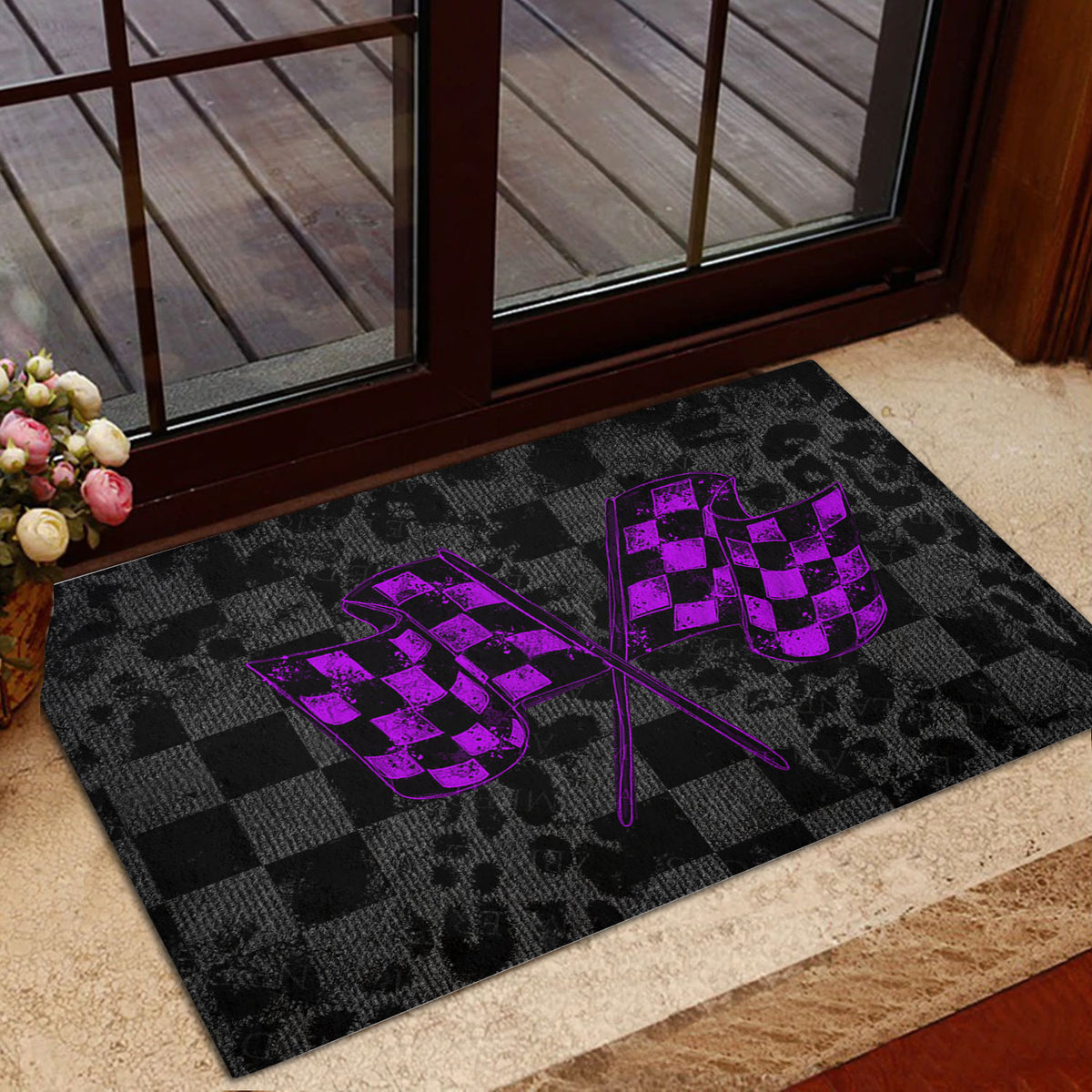 Racing entryway mat with purple checkered flags displayed beside a glass door