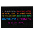 Black LGBT doormat with colorful equality messages and bold rainbow-inspired lettering