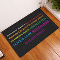 LGBT entryway mat displayed by a white door with colorful equality-themed lettering