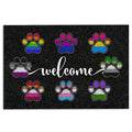 Black LGBT doormat with colorful pride-inspired paw prints and a white welcome message