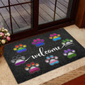 LGBT paw print welcome mat displayed inside a glass doorway near an entrance