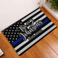Police-support doormat displayed in an indoor entryway on a wood floor