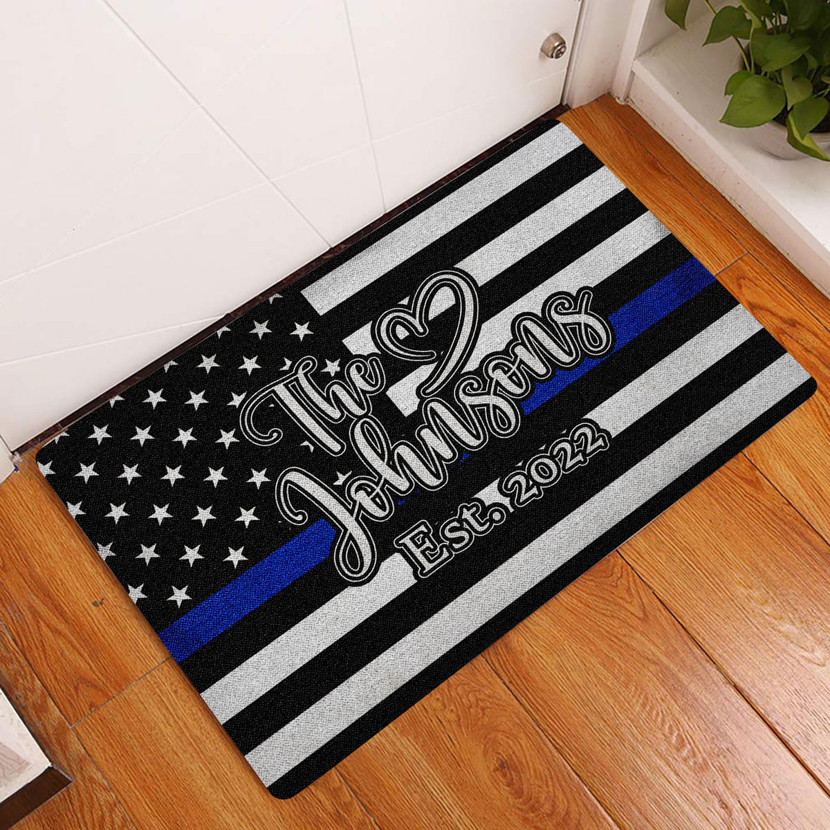Police-support doormat displayed in an indoor entryway on a wood floor