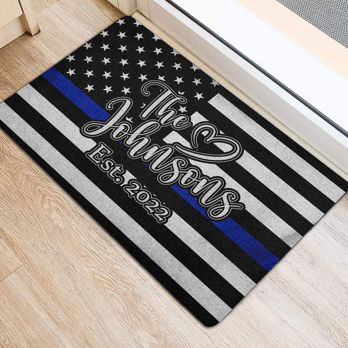 Police-support flag design door mat positioned beside an interior doorway