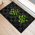 Racing-themed checkered flag door mat positioned beside an interior doorway