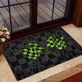 Checkered racing flag entryway mat styled near a glass door and indoor flooring