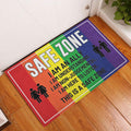 LGBT rainbow safe zone door mat displayed at a home entrance on a warm wood floor