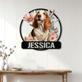 Floral Basset Hound wall sign displayed on a bright paneled wall above a wooden console table