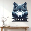 Wolf portrait metal wall sign displayed on a light wood-paneled wall above a console table