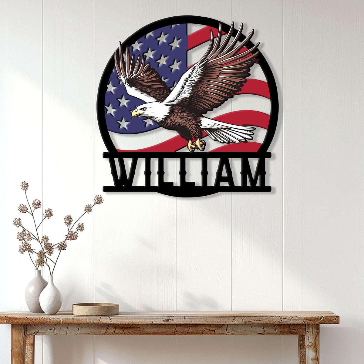 Patriotic bald eagle wall sign displayed on a white paneled wall above a wood console table