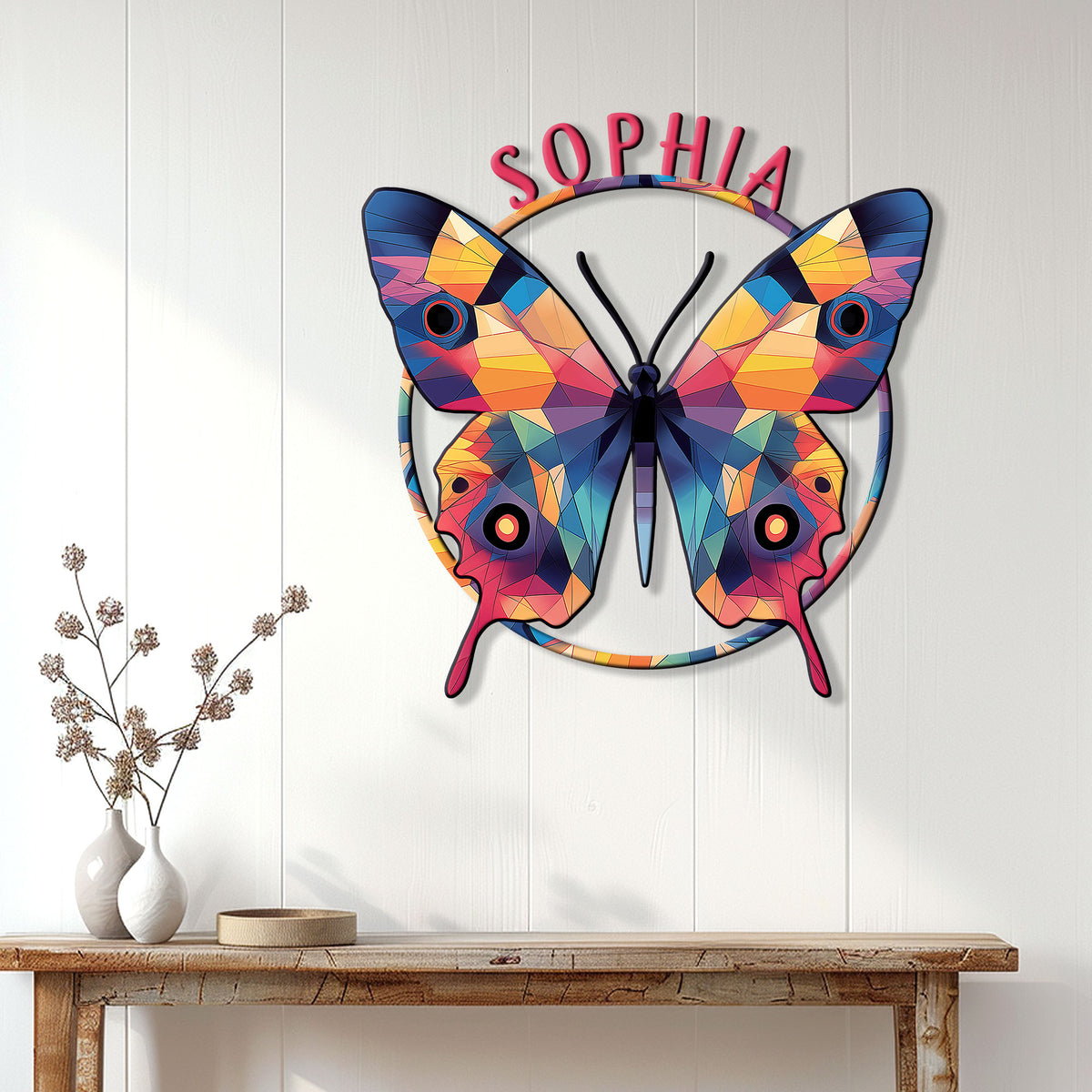 Colorful butterfly wall decor displayed on a white paneled wall above a wood console table