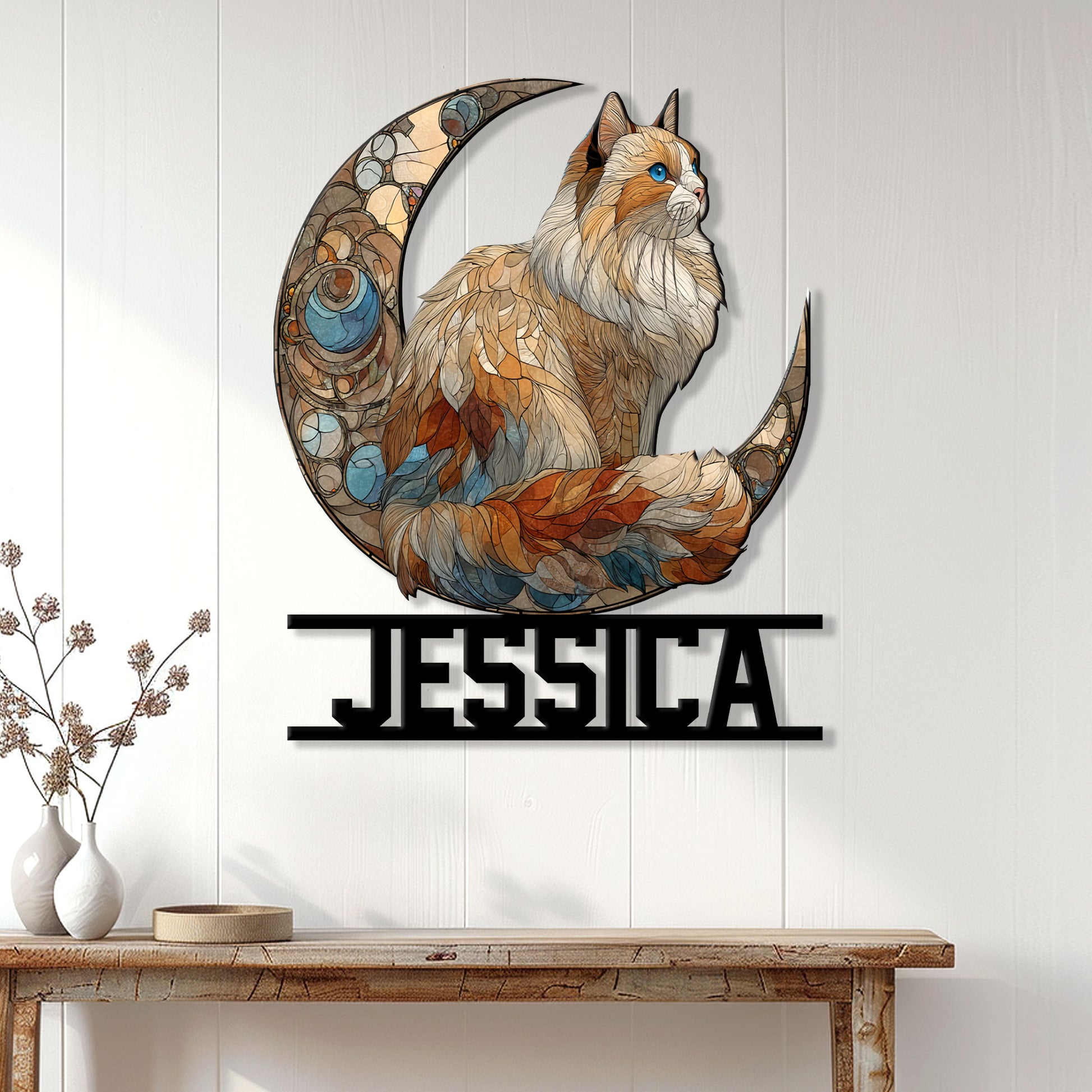 Ragdoll cat moon metal wall sign displayed on a light wood-paneled wall above a console table