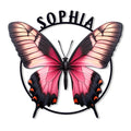 Detailed pink and black butterfly metal sign with patterned wings and a circular frame