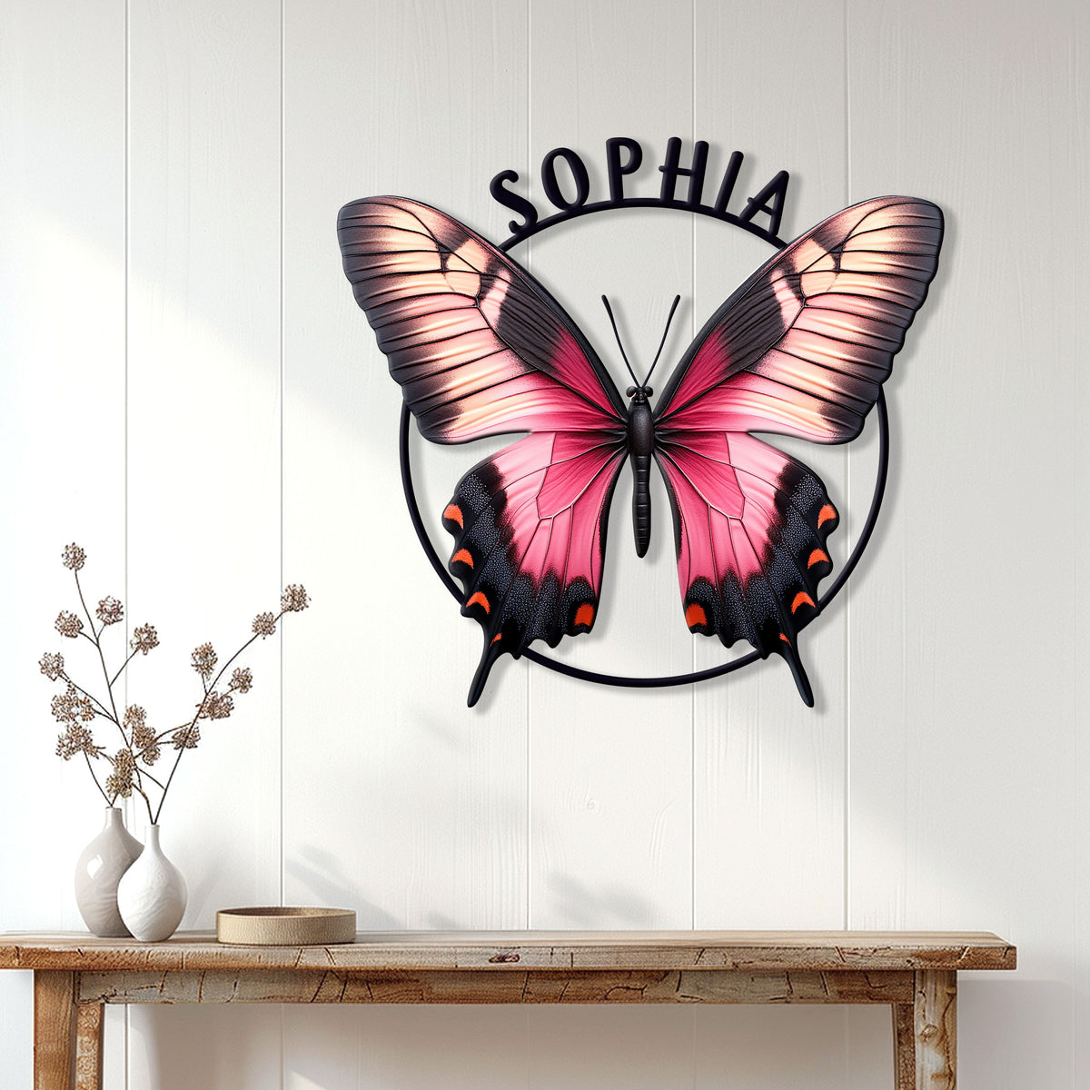 Pink butterfly wall decor displayed on a white paneled wall above a console table