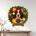 English Springer Spaniel Christmas wall sign displayed on a white paneled wall above a console table