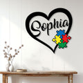 Autism heart metal wall sign displayed above a console table in a bright home entryway