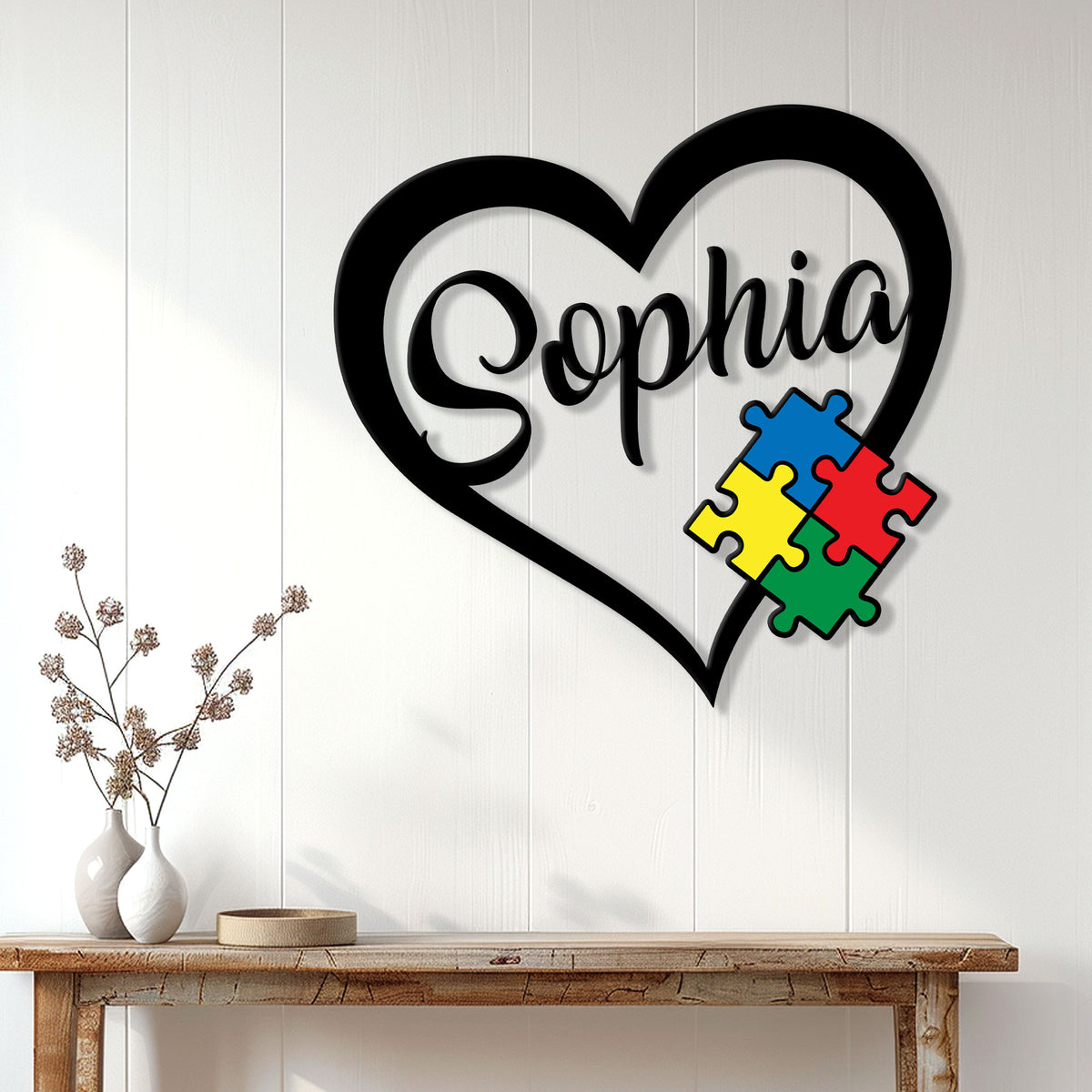 Autism heart metal wall sign displayed above a console table in a bright home entryway