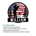 Golf wall sign with a silhouetted golfer framed by pine trees and a bold American flag design
