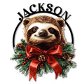 Christmas sloth metal sign featuring a smiling sloth framed by evergreen branches, pinecones, berries, and a red bow