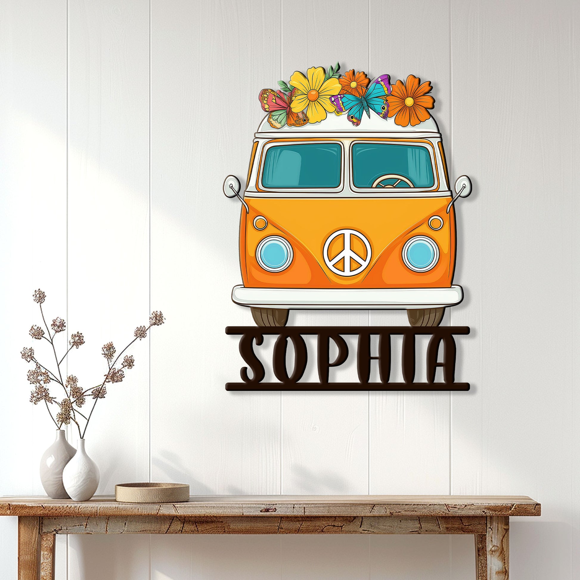 Hippie van wall sign displayed in a bright boho home above a rustic console table