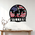 Rodeo bull riding wall decor displayed on a white paneled wall above a rustic console table