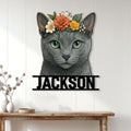 Floral Russian Blue cat metal sign displayed on a light paneled wall above a console table