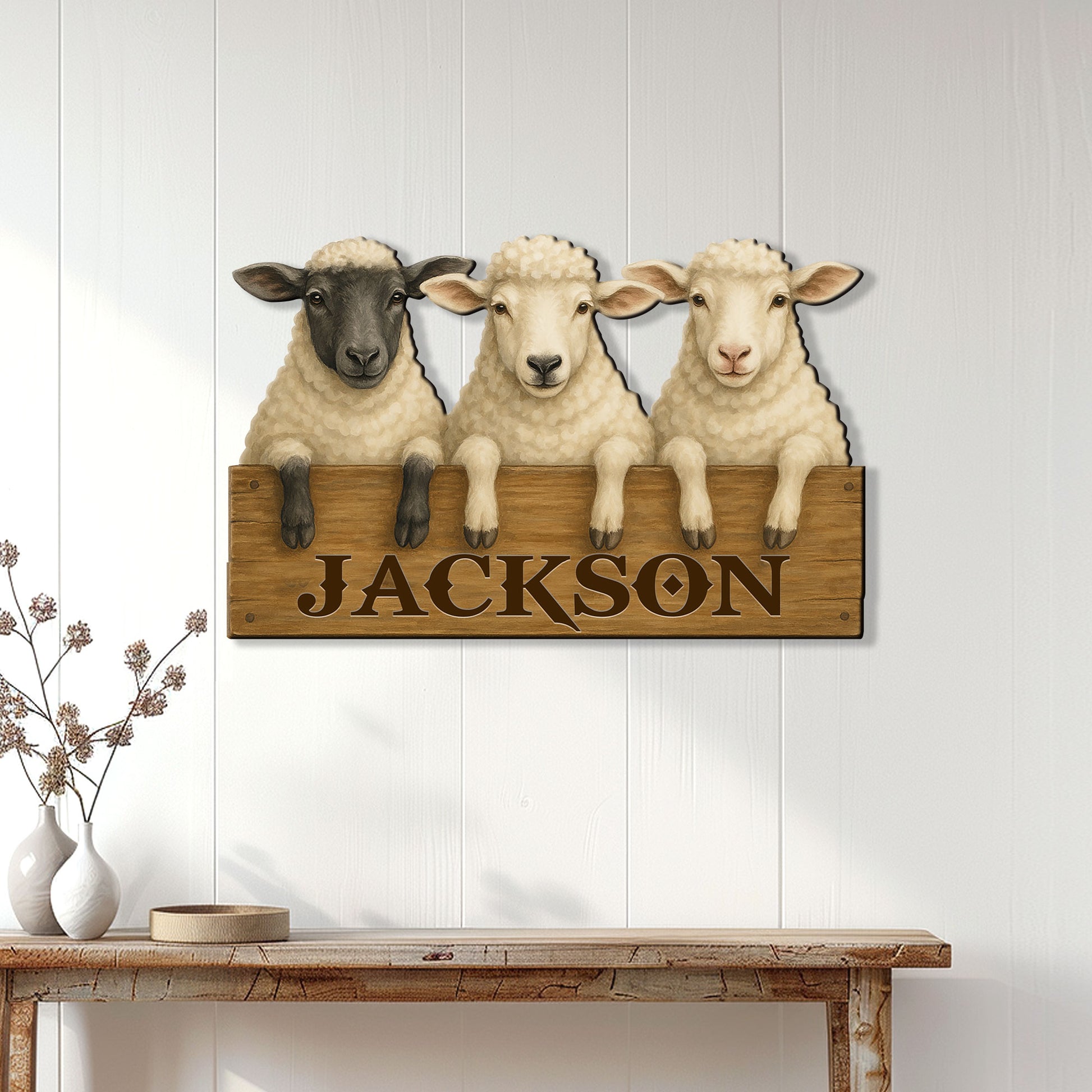 Rustic sheep metal sign displayed on a white paneled wall above a console table