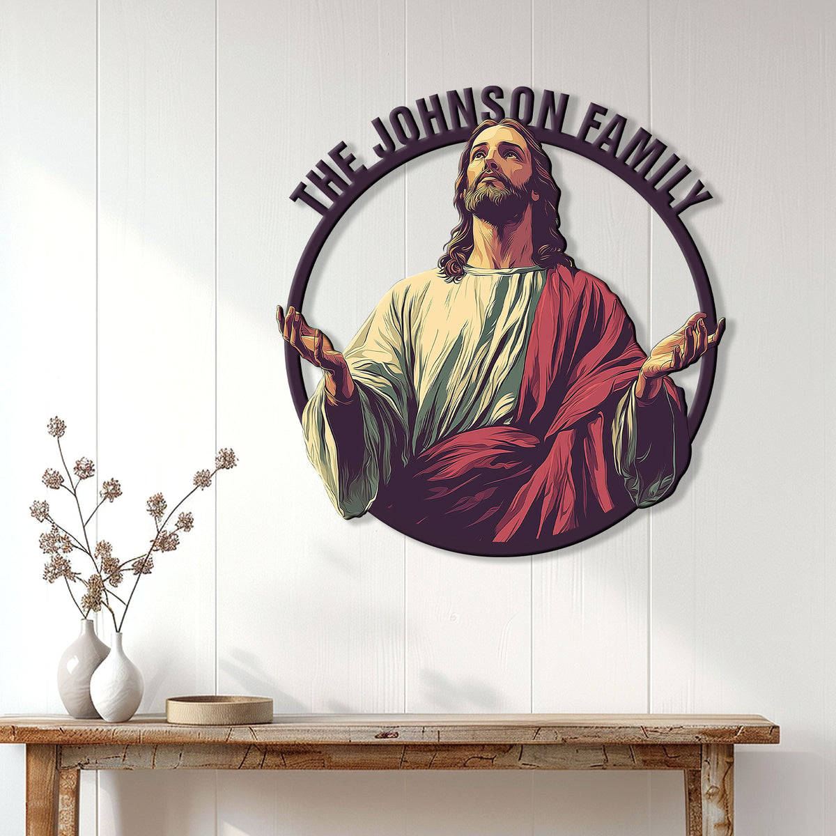 Jesus Christian wall sign displayed above a console table in a bright home interior