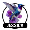 Colorful hummingbird metal sign with purple flowers in a bold circular wall art design
