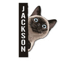 Siamese cat metal sign featuring a realistic peeking cat portrait with bright blue eyes
